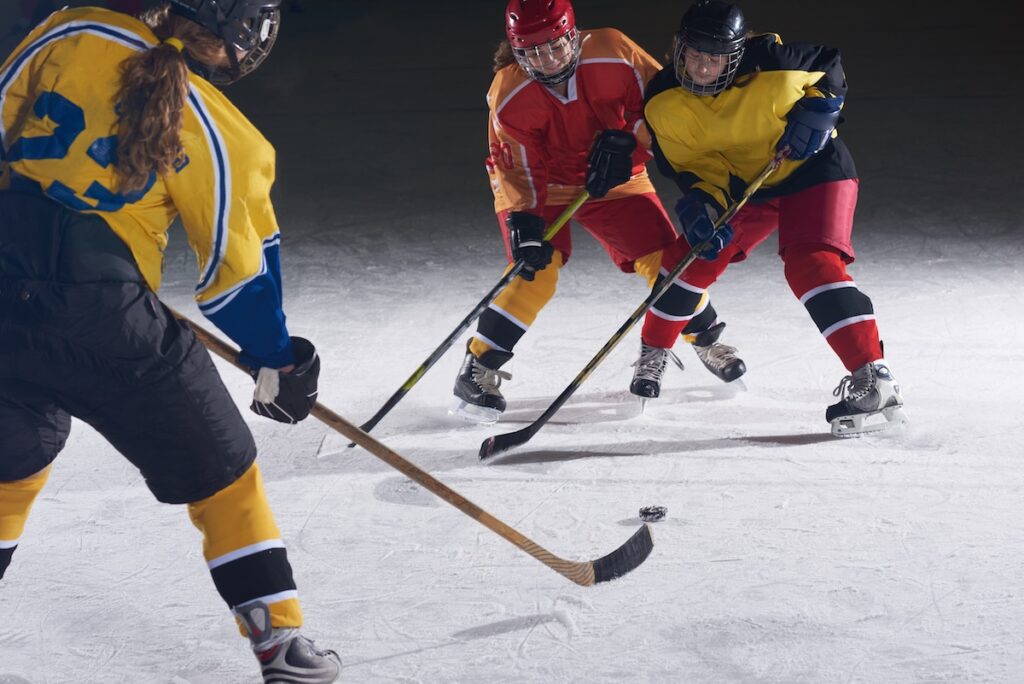 ice hockey sport players in action, business comptetition concpet, teen girls on training